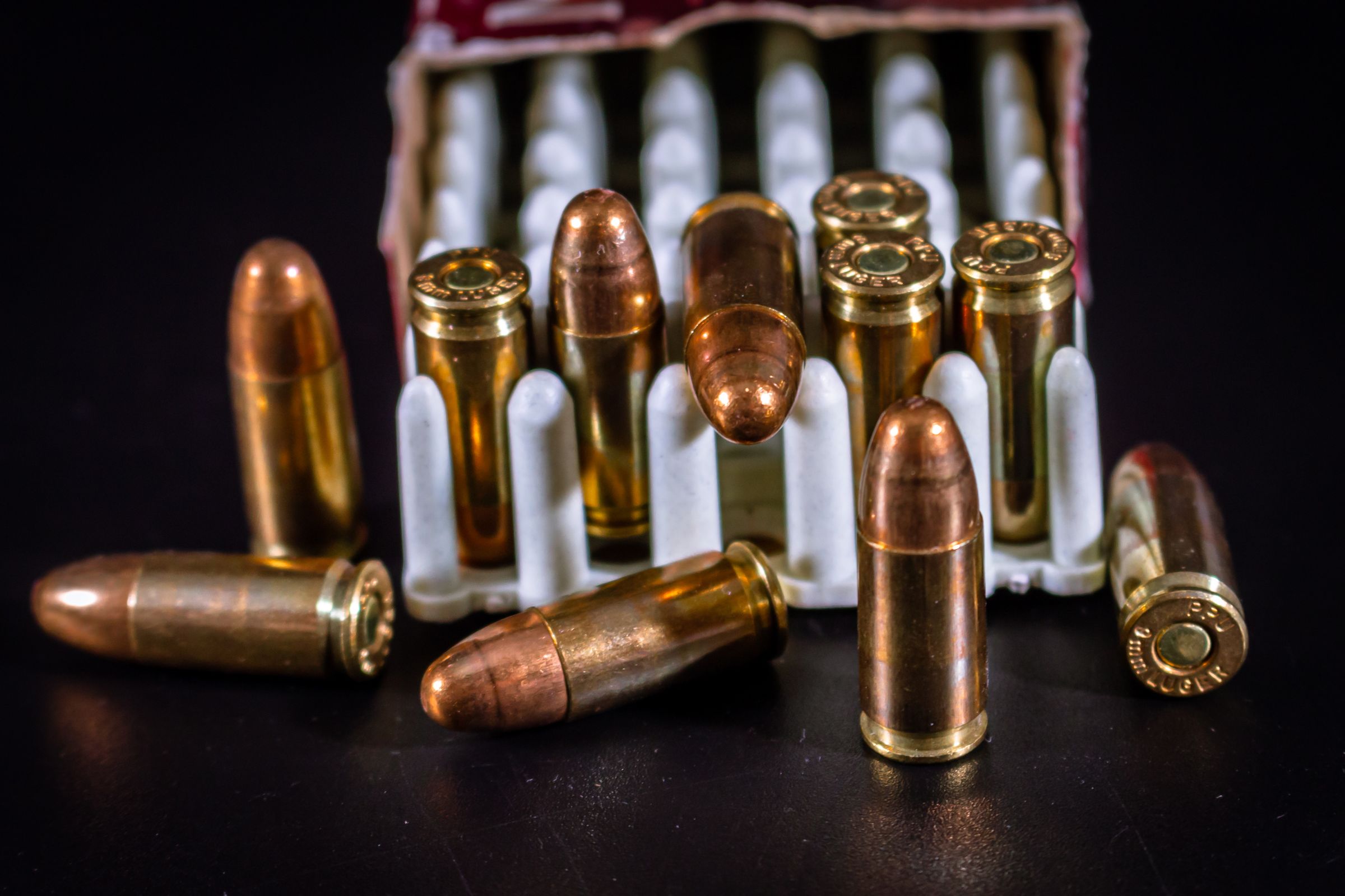 Open box of bulk 9mm ammunition — buying and storing ammo by the case
